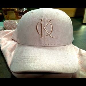 Pink hat with K and O initials from the Kenya Ontiveros line.